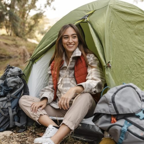 happy-camping-girl-forest-sitting-tent